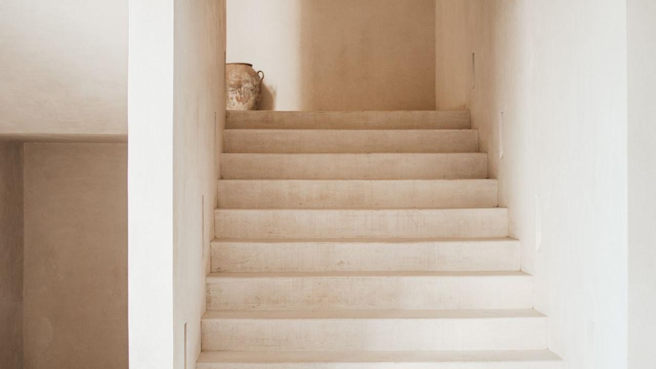 white wooden staircase with white wooden railings